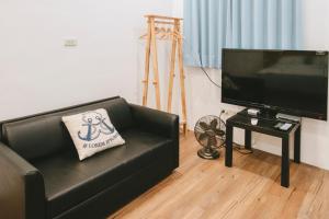 TV a/nebo společenská místnost v ubytování Wind Wave Ocean Homestay