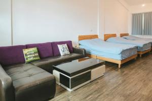 Postel nebo postele na pokoji v ubytování Wind Wave Ocean Homestay