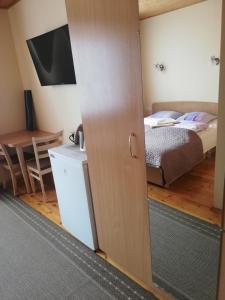 Postel nebo postele na pokoji v ubytování Inkliuzas