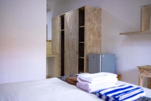Postel nebo postele na pokoji v ubytování Adi Guest House