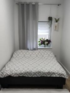 A bed or beds in a room at Two-room apartament