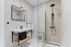 a bathroom with a sink and a shower at NV Sun 23 by Aneo Travel in Novi Vinodolski +16 photos