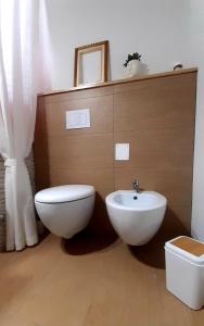 a bathroom with a toilet and a sink at A Casa Di Nonna B&B in Tortoreto Lido