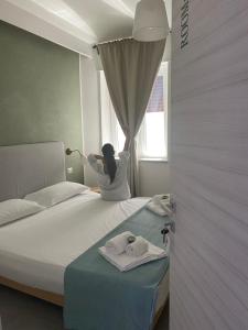 Postel nebo postele na pokoji v ubytování B&B Barù