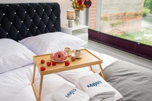 Posteľ alebo postele v izbe v ubytovaní Maya's Flats & Resorts 55 - GRANO RESIDENCE Pszenna 5