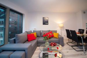 a living room with a couch and a table at Maya's Flats & Resorts 55 - Pszenna 5 in Gdańsk