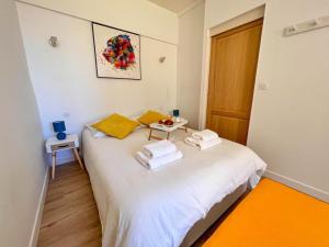 Łóżko lub łóżka w pokoju w obiekcie Appartement vue mer Parking privé Place Med
