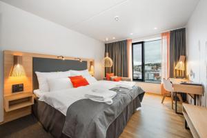 Postel nebo postele na pokoji v ubytování Clarion Hotel The Edge + 37 fotografií