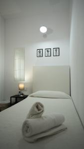 Katil atau katil-katil dalam bilik di Hostal La Premsa