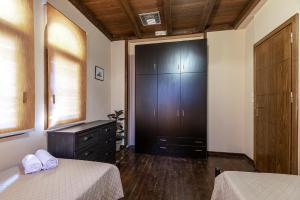 A bed or beds in a room at Selana House with outdoor pool
