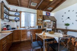 A kitchen or kitchenette at Selana House with outdoor pool