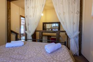 A bed or beds in a room at Selana House with outdoor pool