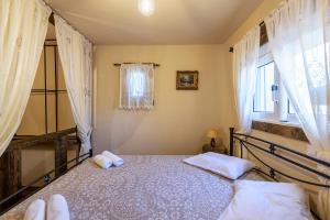 A bed or beds in a room at Selana House with outdoor pool