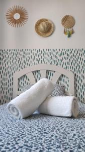 A bed or beds in a room at Pensión Playa