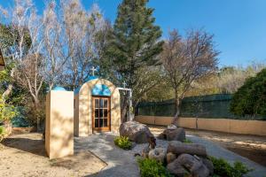 A garden outside Selana House with outdoor pool