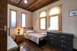 A bed or beds in a room at Selana House with outdoor pool