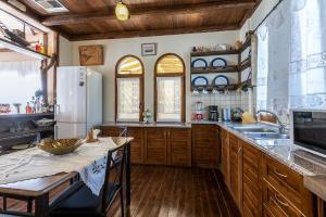 A kitchen or kitchenette at Selana House with outdoor pool