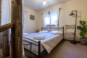 A bed or beds in a room at Selana House with outdoor pool
