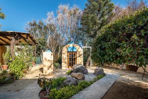 A garden outside Selana House with outdoor pool