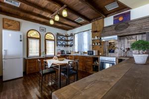 A kitchen or kitchenette at Selana House with outdoor pool