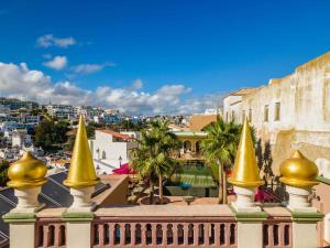 a view of the city from the roof of a building at Vila Origens Boutique Hotel Albufeira – Adults Only in Albufeira