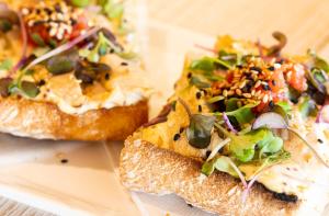 two slices of bread with a salad on it at Hotel Maritim in Roses