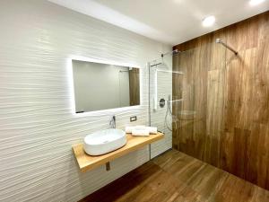 a bathroom with a sink and a shower at PineStreet Apartment in Pieve a Nievole