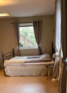 Postel nebo postele na pokoji v ubytování KG SleepOver & Ställplats