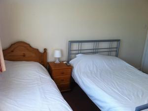 Ein Bett oder Betten in einem Zimmer der Unterkunft Hillingdon Lodge