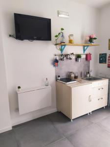 TV a/nebo společenská místnost v ubytování PEONIA 2 posti Wi-Fi AC free park Jacuzzi