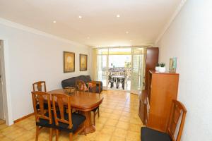 a living room with a table and a dining room at DIFFERENTFLATS Florida in Salou