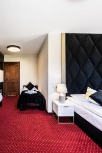 Posteľ alebo postele v izbe v ubytovaní Dworek pod Giewontem - Jacuzzi & Sauna