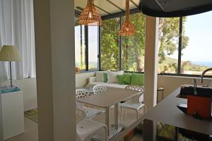 a living room with a couch and a table at Villa ALFONSA in Saint-Raphaël +32 photos