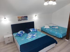 Postel nebo postele na pokoji v ubytování Vila Coty