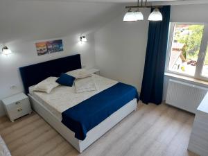 Postel nebo postele na pokoji v ubytování Vila Coty