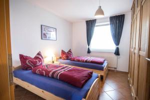 Rúm í herbergi á Ferienwohnung-Seaside-Neue-Reihe