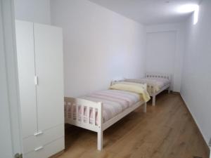 A bed or beds in a room at Apartamento Garcar