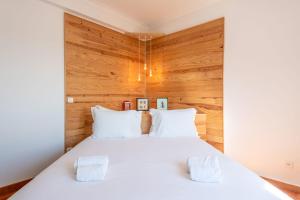 Postel nebo postele na pokoji v ubytování GuestReady - A Vibrant Getaway