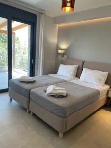 מיטה או מיטות בחדר ב-Iris Villas Complex