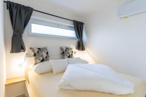 Voodi või voodid majutusasutuse Izi Apartman toas