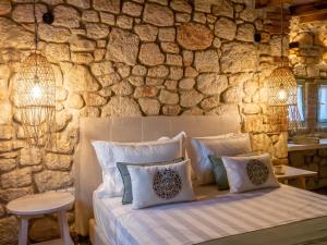 Ένα ή περισσότερα κρεβάτια σε δωμάτιο στο Petrino Eco Village