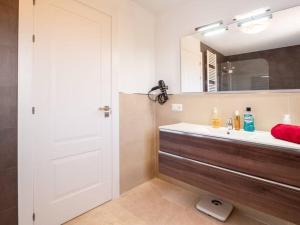 a bathroom with a sink and a mirror at Villa HEIDI in Málaga