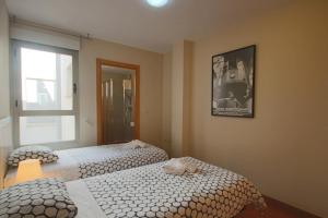 Cama ou camas em um quarto em Homeincalpe Borumbot