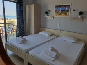 A bed or beds in a room at Blue Horizon