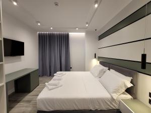 Säng eller sängar i ett rum på ADMIRO Hotel