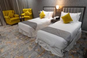 Postel nebo postele na pokoji v ubytování WS Hotel