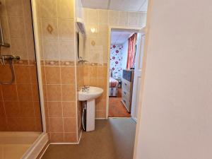 a bathroom with a sink and a shower at The Albany hotel in Blackpool