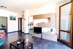 Televízia a/alebo spoločenská miestnosť v ubytovaní La Senyera Apartment