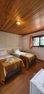 Ένα ή περισσότερα κρεβάτια σε δωμάτιο στο Hotel Alpen Hof