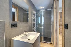 a bathroom with a sink and a shower at Amazing chalet in Chamonix-Mont-Blanc